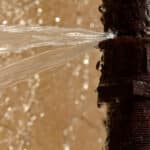 Rusty burst pipe in Baku Botanic Garden